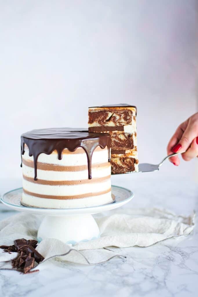 Zebra Marble Layer Cake | Classic combination of chocolate and vanilla flavours with a  zebra pattern twist! Soft and moist cake, filled with rich chocolate ganache and silky vanilla ermine buttercream. | www.anasbakingchronicles.com