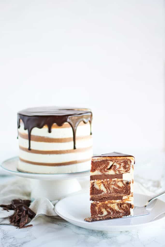 Zebra Marble Layer Cake | Classic combination of chocolate and vanilla flavours with a  zebra pattern twist! Soft and moist cake, filled with rich chocolate ganache and silky vanilla ermine buttercream. | www.anasbakingchronicles.com