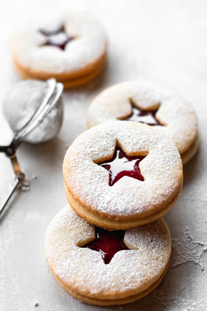 Traditionally made for Christmas and other holidays, these Linzer cookies are soft but crumbly, sandwiched together with homemade raspberry jam.⎪www.anasbakingchronicles.com