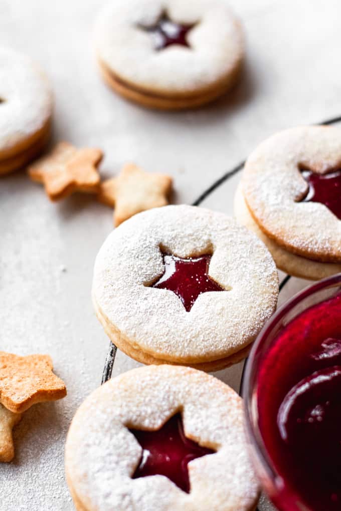 Traditionally made for Christmas and other holidays, these Linzer cookies are soft but crumbly, sandwiched together with homemade raspberry jam.⎪www.anasbakingchronicles.com