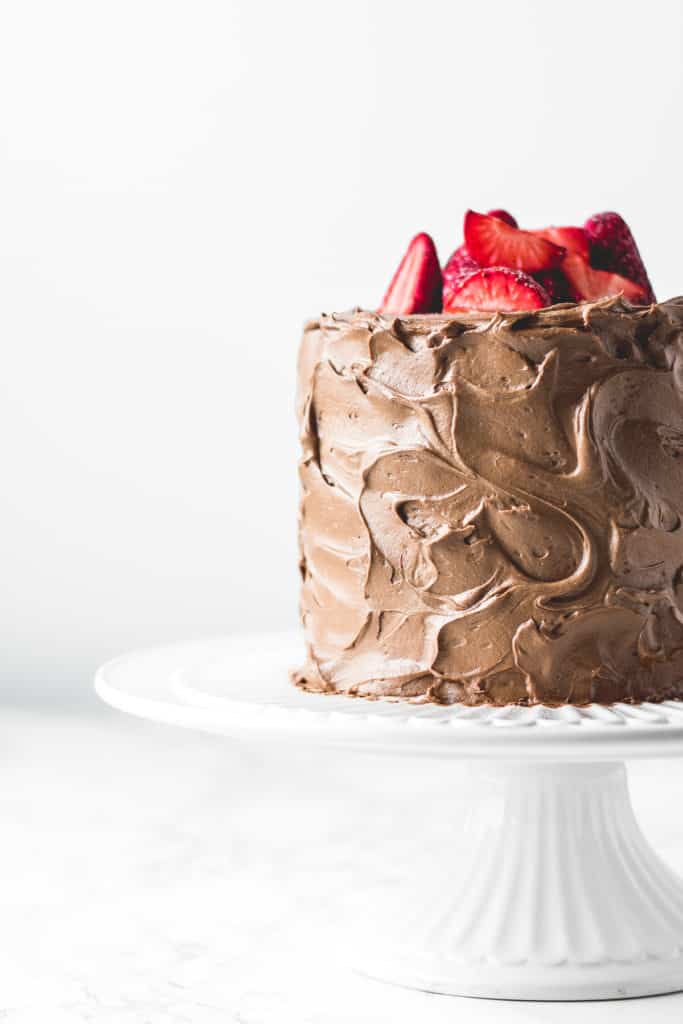 Three layers of rich and soft chocolate cake, paired with light and airy chocolate buttercream and filled with luscious dark chocolate ganache.  It doesn't get more chocolatey than this!⎪www.anasbakingchronicles.com