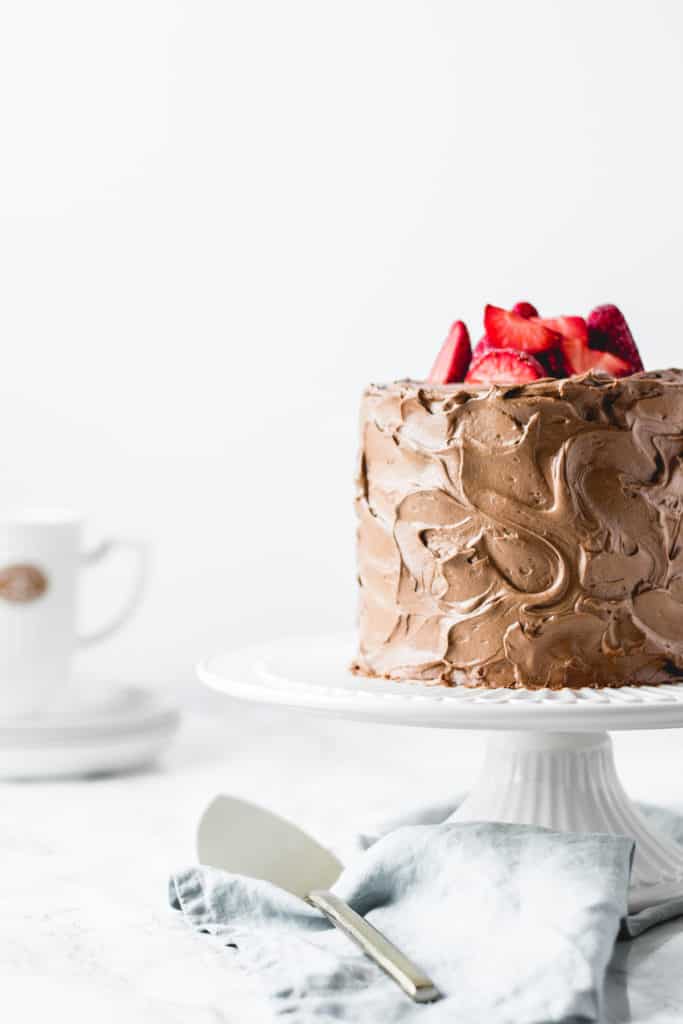 Three layers of rich and soft chocolate cake, paired with light and airy chocolate buttercream and filled with luscious dark chocolate ganache.  It doesn't get more chocolatey than this!⎪www.anasbakingchronicles.com