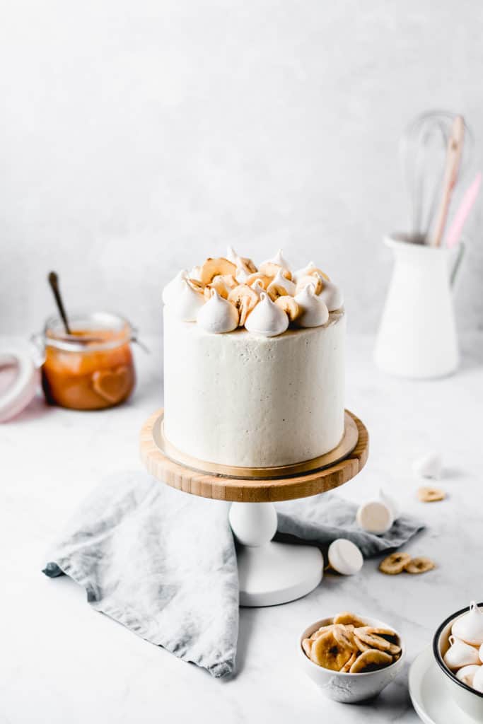 This Dulce de leche Banana Cake is a dream come true! Rich and moist banana cake layers are filled with luscious dulce de leche and coated in the most beautiful vanilla bean frosting! Perfect for Mother's Day! ⎪www.anasbakingchronicles.com