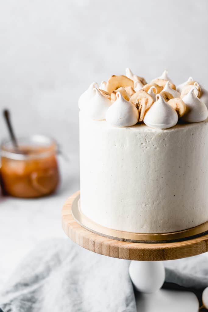 This Dulce de leche Banana Cake is a dream come true! Rich and moist banana cake layers are filled with luscious dulce de leche and coated in the most beautiful vanilla bean frosting! Perfect for Mother's Day! ⎪www.anasbakingchronicles.com