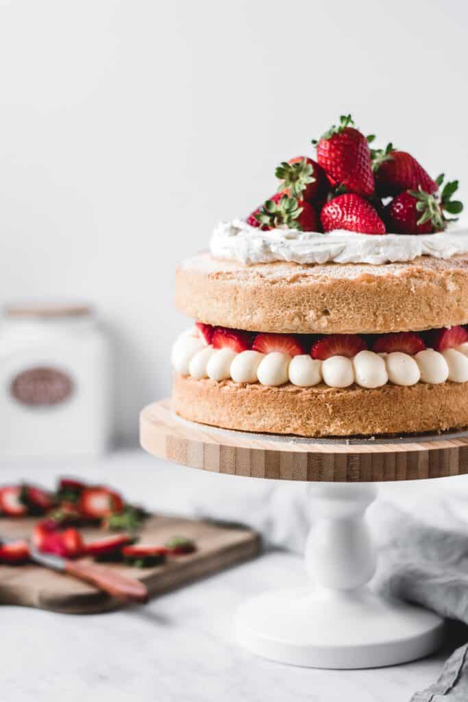 This is one of those traditional bakes that everyone's going to love. Soft and fluffy vanilla cake layers filled with light and airy diplomat cream and fresh strawberries. Delicious!⎪www.anasbakingchronicles.com