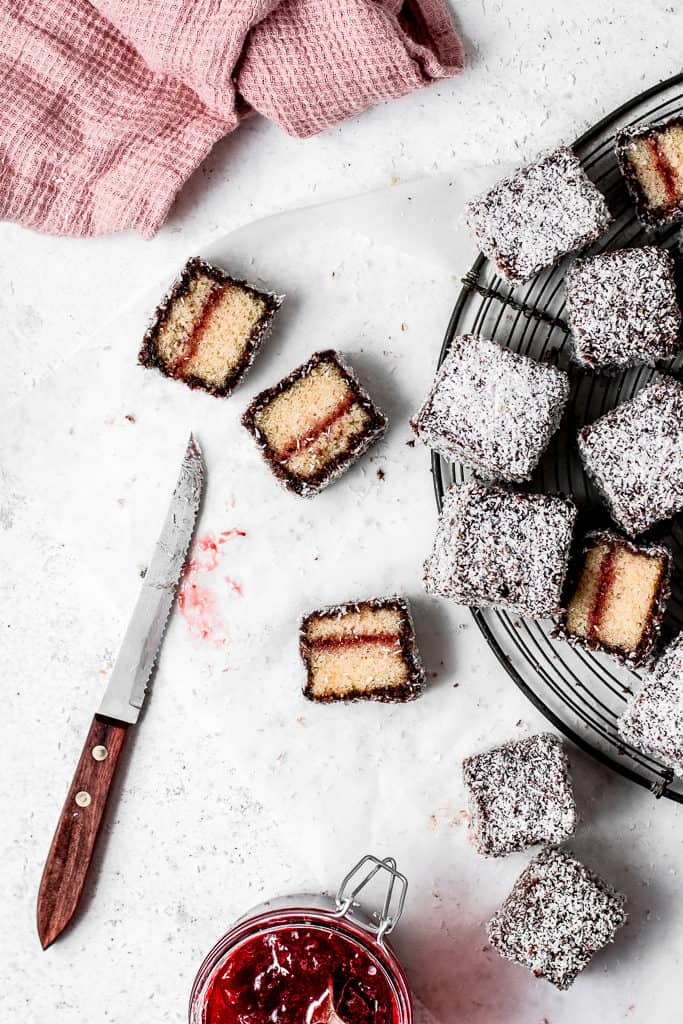 These Lamingtons are the perfect combination of soft and moist vanilla cake, strawberry jam and luscious chocolate icing with coconut coating. Perfect for the holidays or a Sunday afternoon! ⎪www.anasbakingchronicles.com