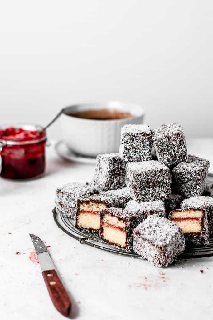 These Lamingtons are the perfect combination of soft and moist vanilla cake, strawberry jam and luscious chocolate icing with coconut coating. Perfect for the holidays or a Sunday afternoon! ⎪www.anasbakingchronicles.com