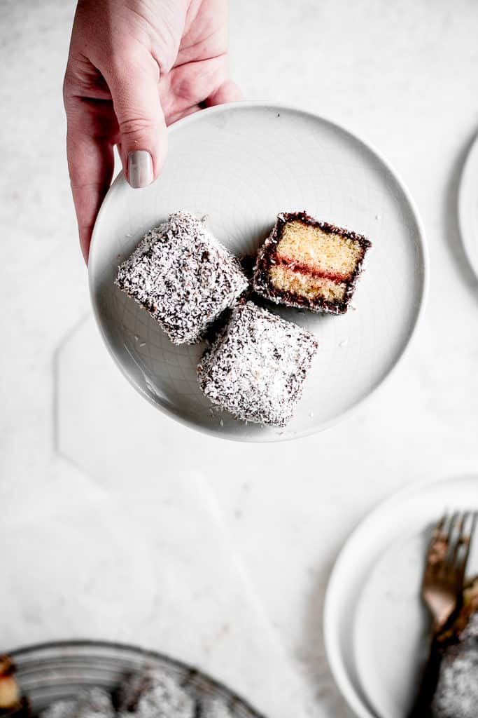 These Lamingtons are the perfect combination of soft and moist vanilla cake, strawberry jam and luscious chocolate icing with coconut coating. Perfect for the holidays or a Sunday afternoon! ⎪www.anasbakingchronicles.com