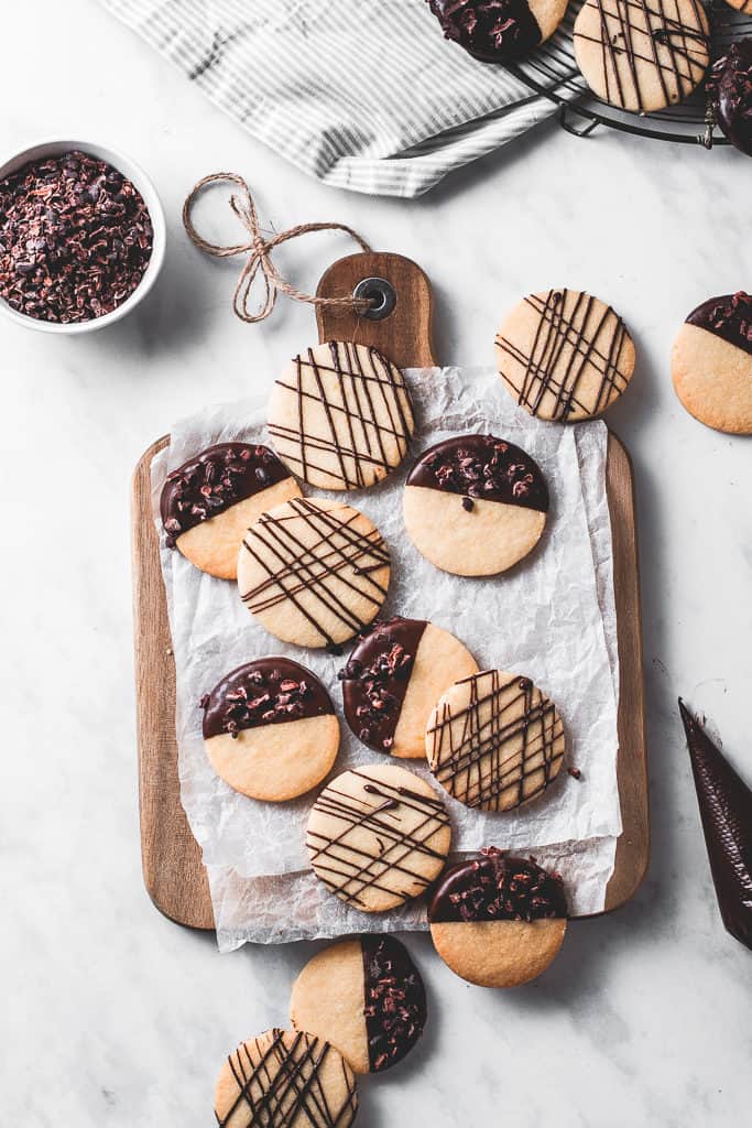 These buttery, melt-in-your-mouth orange shortbread cookies are dipped in chocolate and incredibly easy to make - a classic with a twist!⎪www.anasbakingchronicles.com