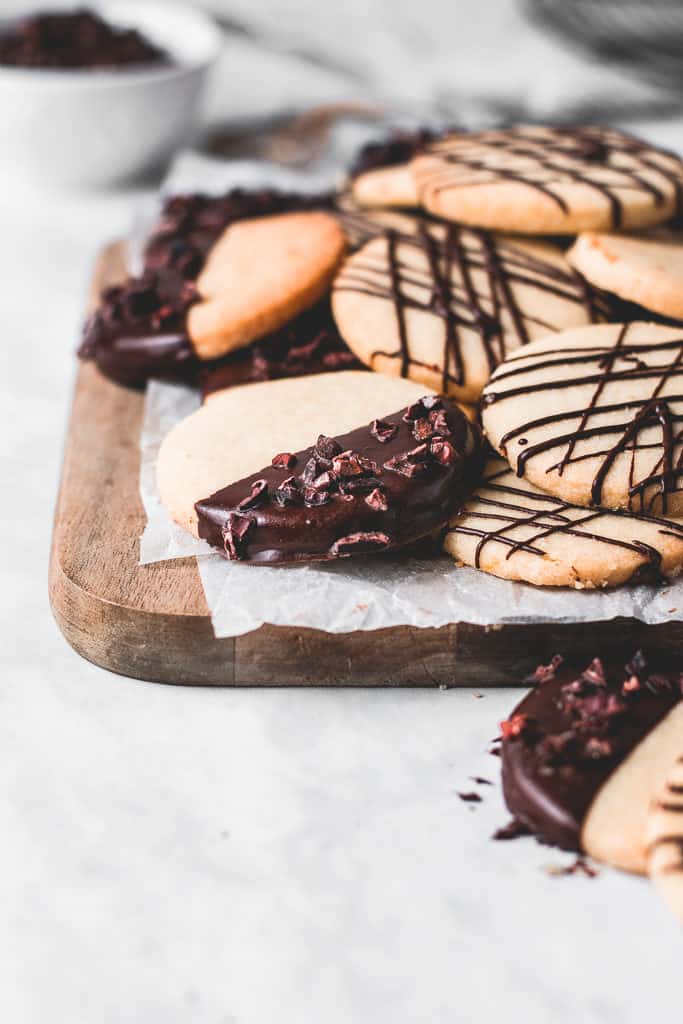 These buttery, melt-in-your-mouth orange shortbread cookies are dipped in chocolate and incredibly easy to make - a classic with a twist!⎪www.anasbakingchronicles.com