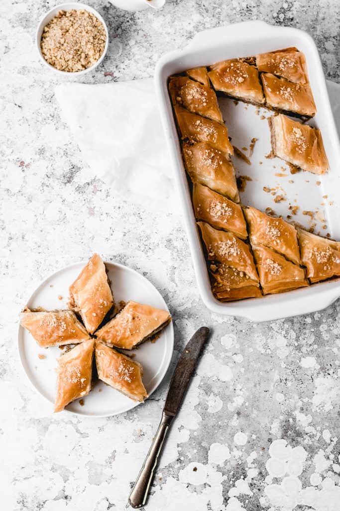 Classic Balkan walnut baklava, spiced with cinnamon and soaked with orange and lemon infused sugar syrup. Easy to make and ready for cozy fall weekends! | www,anasbakingchronicles.com