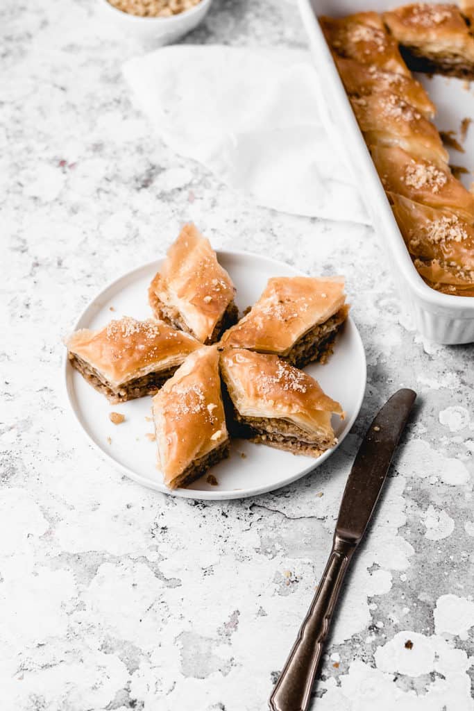 Classic Balkan walnut baklava, spiced with cinnamon and soaked with orange and lemon infused sugar syrup. Easy to make and ready for cozy fall weekends! | www,anasbakingchronicles.com