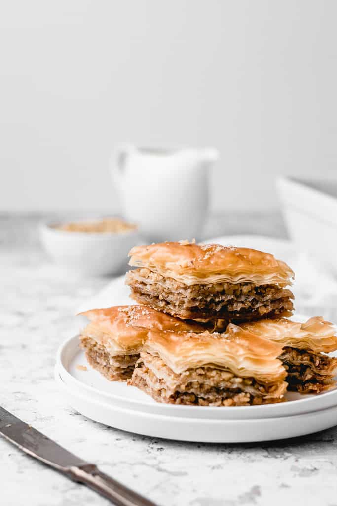 Classic Balkan walnut baklava, spiced with cinnamon and soaked with orange and lemon infused sugar syrup. Easy to make and ready for cozy fall weekends! | www,anasbakingchronicles.com