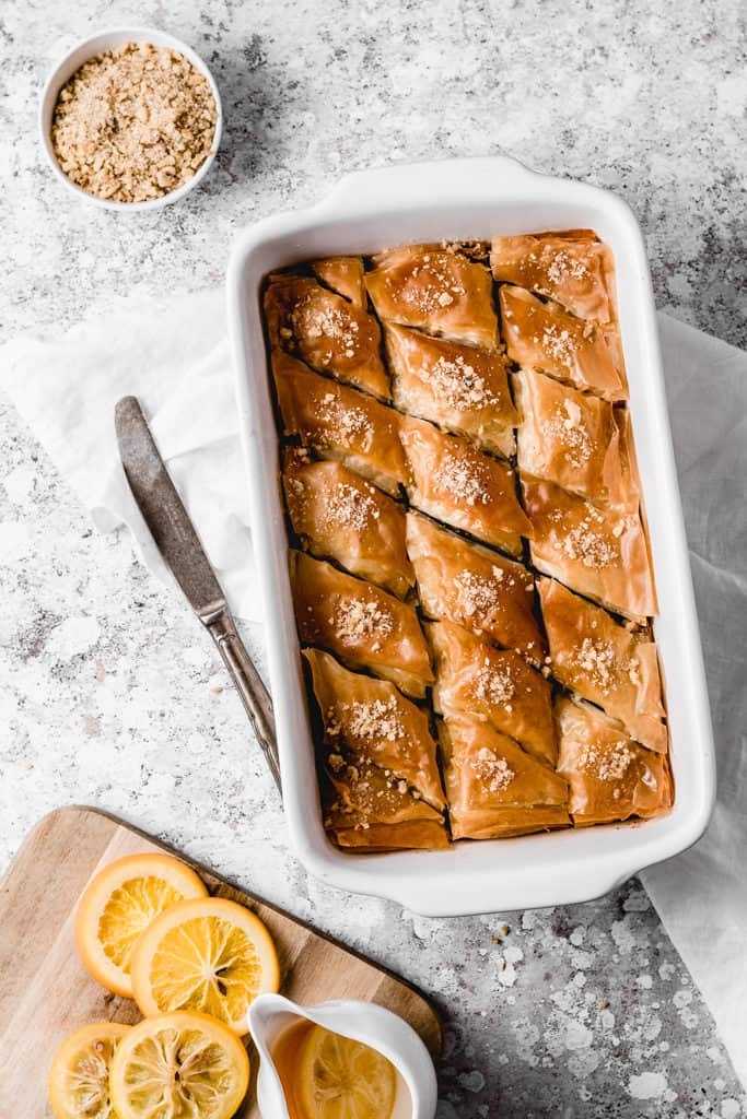 Classic Balkan walnut baklava, spiced with cinnamon and soaked with orange and lemon infused sugar syrup. Easy to make and ready for cozy fall weekends! | www,anasbakingchronicles.com