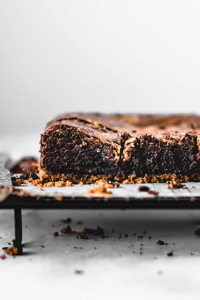 These Cookie Butter Swirl Brownies are one of the best things I've ever made. With a biscoff cookie crust on the bottom, luscious fudgy brownie in the middle and biscoff cookie butter swirl on top - this is THE chocolate dessert you need in your life!