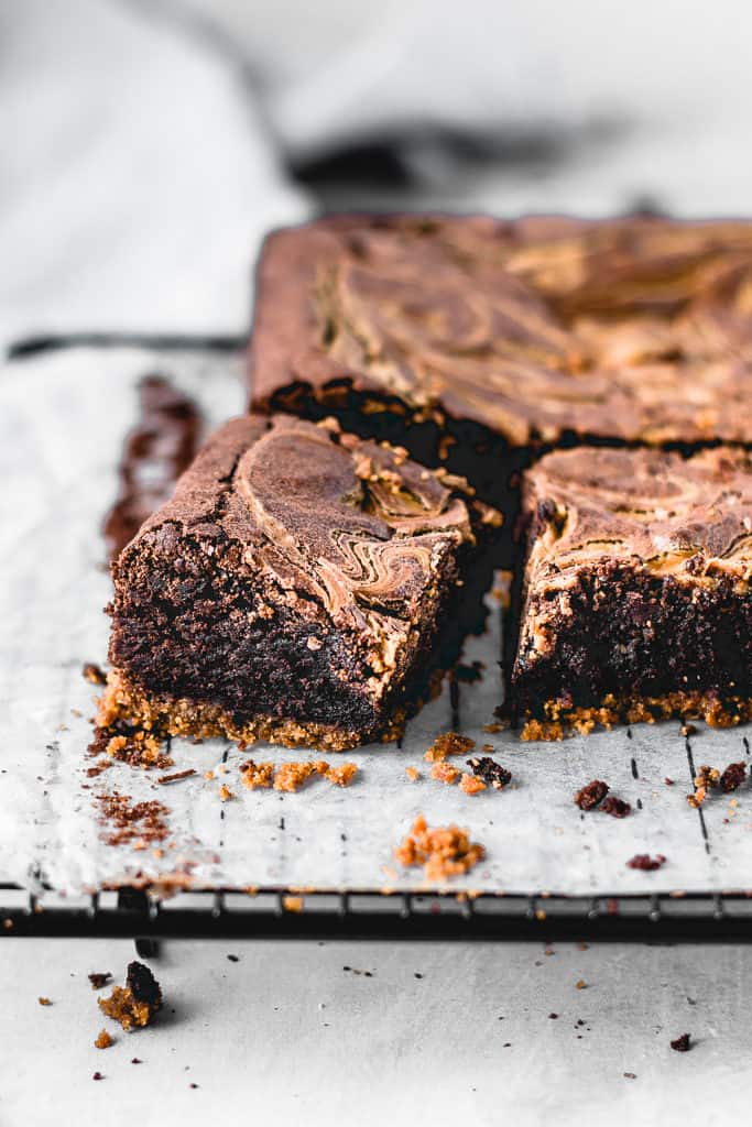 These Cookie Butter Swirl Brownies are one of the best things I've ever made. With a biscoff cookie crust on the bottom, luscious fudgy brownie in the middle and biscoff cookie butter swirl on top - this is THE chocolate dessert you need in your life!