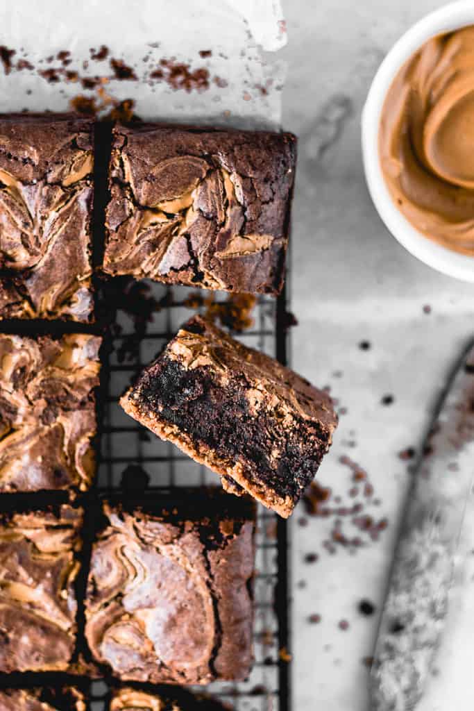 These Cookie Butter Swirl Brownies are one of the best things I've ever made. With a biscoff cookie crust on the bottom, luscious fudgy brownie in the middle and biscoff cookie butter swirl on top - this is THE chocolate dessert you need in your life!