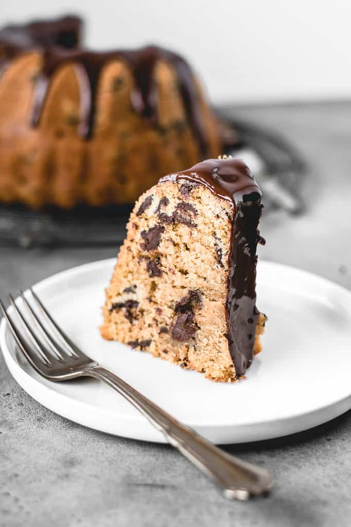 This Chocolate Chip Pumpkin Bundt Cake is a perfect fall treat! Incredibly moist and delicious pumpkin spice cake with chocolate chips and covered in decadent chocolate glaze.⎪www.anasbakingchronicles.com