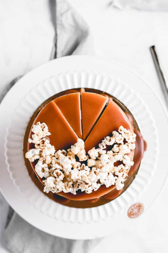 Three layers of rich, moist chocolate cake, paired with amazing brown butter popcorn frosting and caramel popcorn in between the layers for a little bit of crunch! Heavily drizzled with caramel sauce, this Caramel Popcorn Chocolate Cake is a showstopper! ⎪www.anasbakingchronicles.com

#chocolatecake
#caramelpopcorn
#caramelpopcorncake
#brownbutterfrosting 