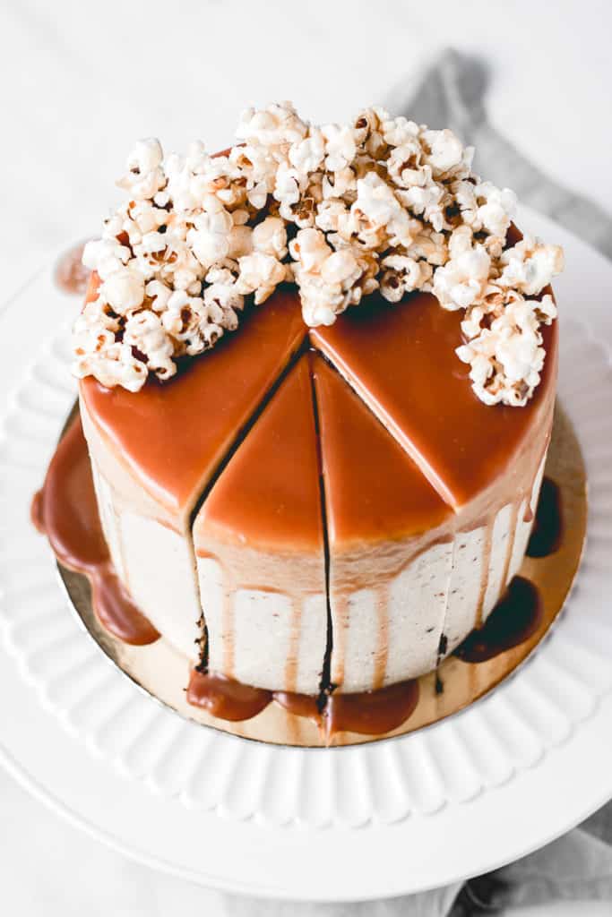 Three layers of rich, moist chocolate cake, paired with amazing brown butter popcorn frosting and caramel popcorn in between the layers for a little bit of crunch! Heavily drizzled with caramel sauce, this Caramel Popcorn Chocolate Cake is a showstopper! ⎪www.anasbakingchronicles.com

#chocolatecake
#caramelpopcorn
#caramelpopcorncake
#brownbutterfrosting 