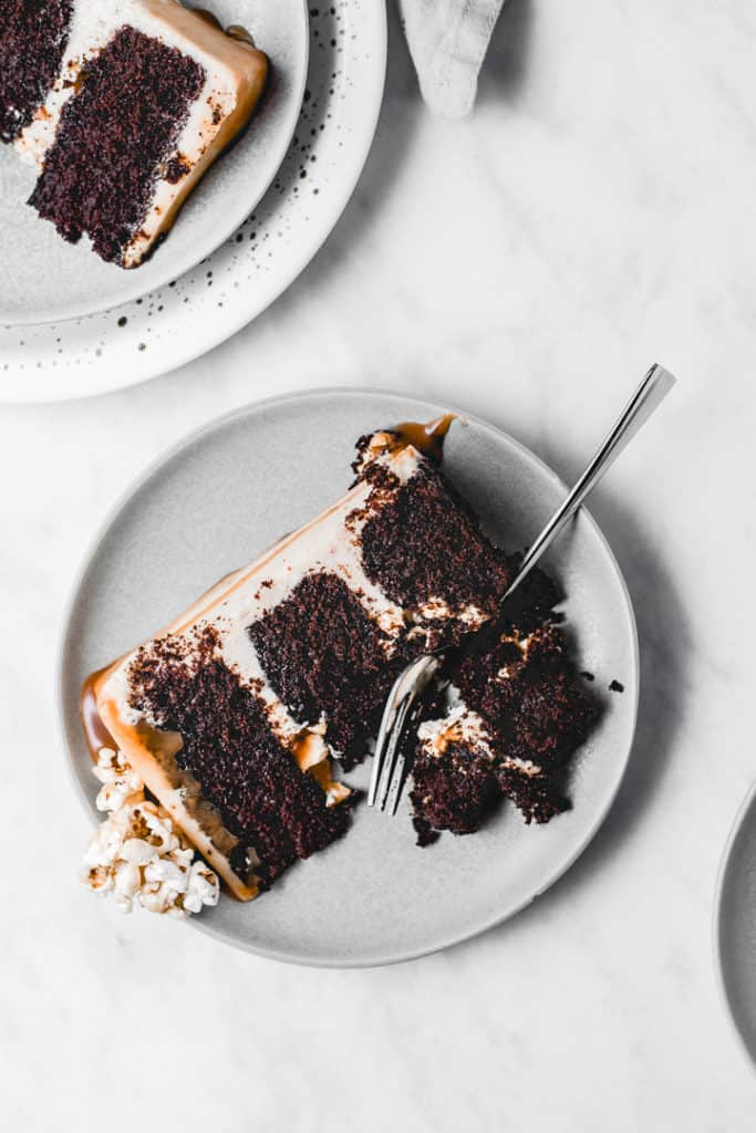 Three layers of rich, moist chocolate cake, paired with amazing brown butter popcorn frosting and caramel popcorn in between the layers for a little bit of crunch! Heavily drizzled with caramel sauce, this Caramel Popcorn Chocolate Cake is a showstopper! ⎪www.anasbakingchronicles.com

#chocolatecake
#caramelpopcorn
#caramelpopcorncake
#brownbutterfrosting 