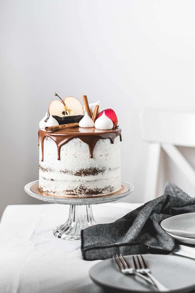 Fluffy and moist carob apple cake, filled with delicious chocolate ganache and coated in light rum buttercream frosting. Perfect fall combination! | www.anasbakingchronicles.com