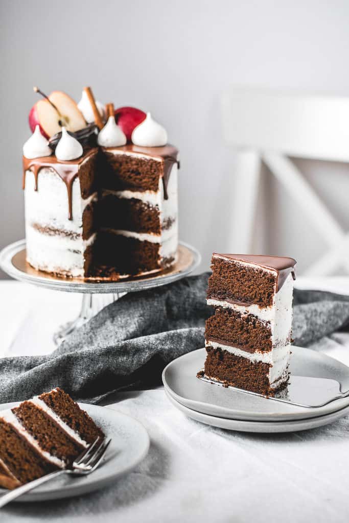 Fluffy and moist carob apple cake, filled with delicious chocolate ganache and coated in light rum buttercream frosting. Perfect fall combination! | www.anasbakingchronicles.com