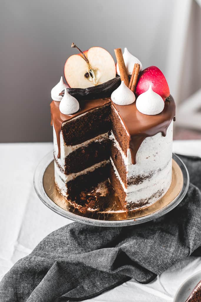 Fluffy and moist carob apple cake, filled with delicious chocolate ganache and coated in light rum buttercream frosting. Perfect fall combination! | www.anasbakingchronicles.com