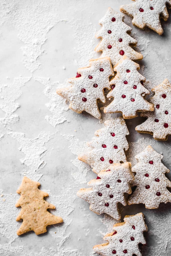 These lovely Pistachio Cranberry Linzer Christmas trees are going to be the star of your holiday table! With their festive looks and delicious flavour, they will win everyone's heart! ⎪www.anasbakingchronicles.com

#christmascookies
#christmasbaking
#linzercookies