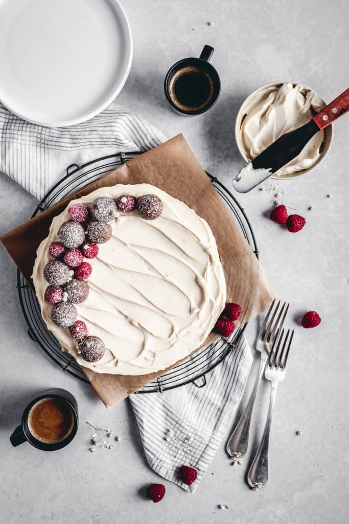 Flourless and gluten free chocolate cake with Irish cream mascarpone frosting and coffee mugs.