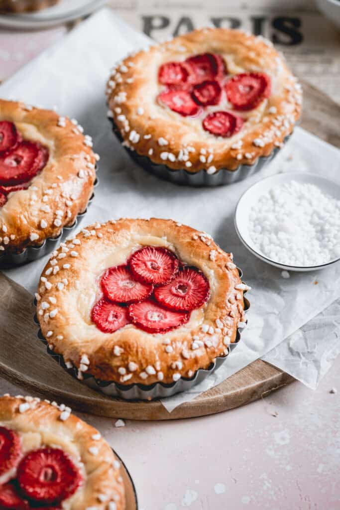 Brioche tarts made with tonka bean pastry cream and strawberries. 