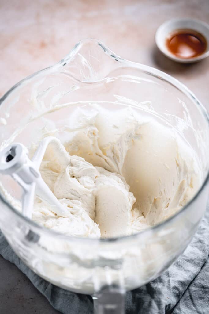 Flour buttercream in a glass mixing bowl.