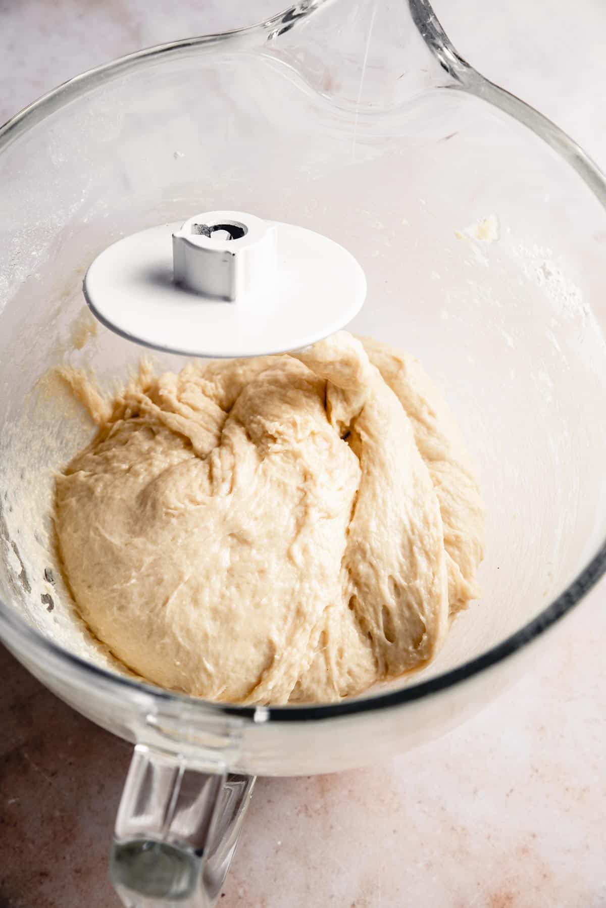 Dough that's finished kneading, in a bowl.