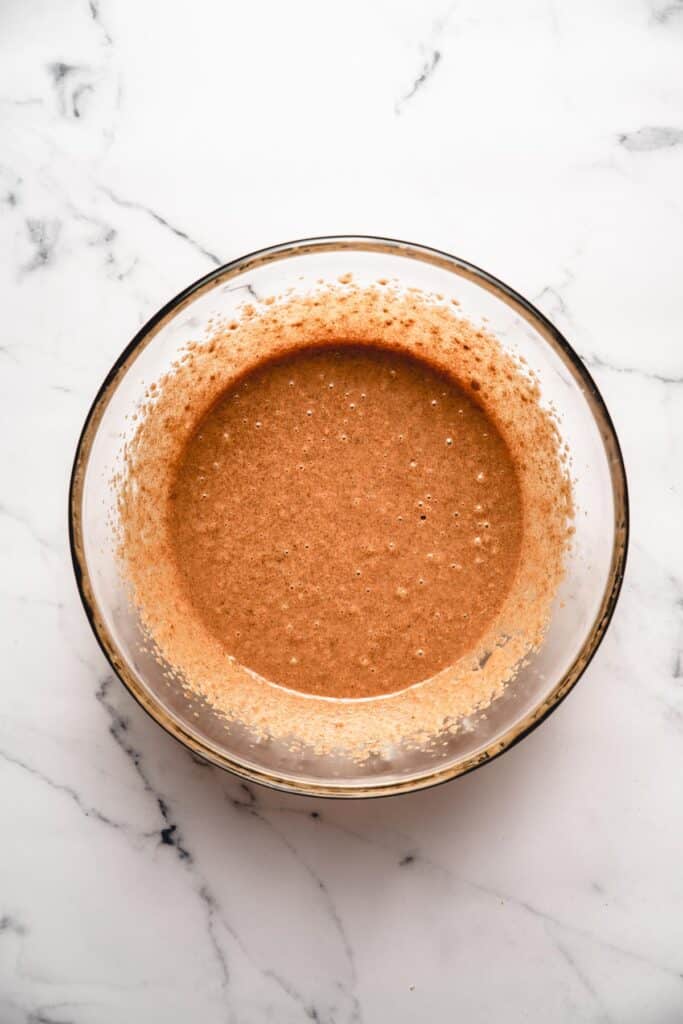 Step 1. Mixing bowl showing mixed peanut butter with oil and sugar.