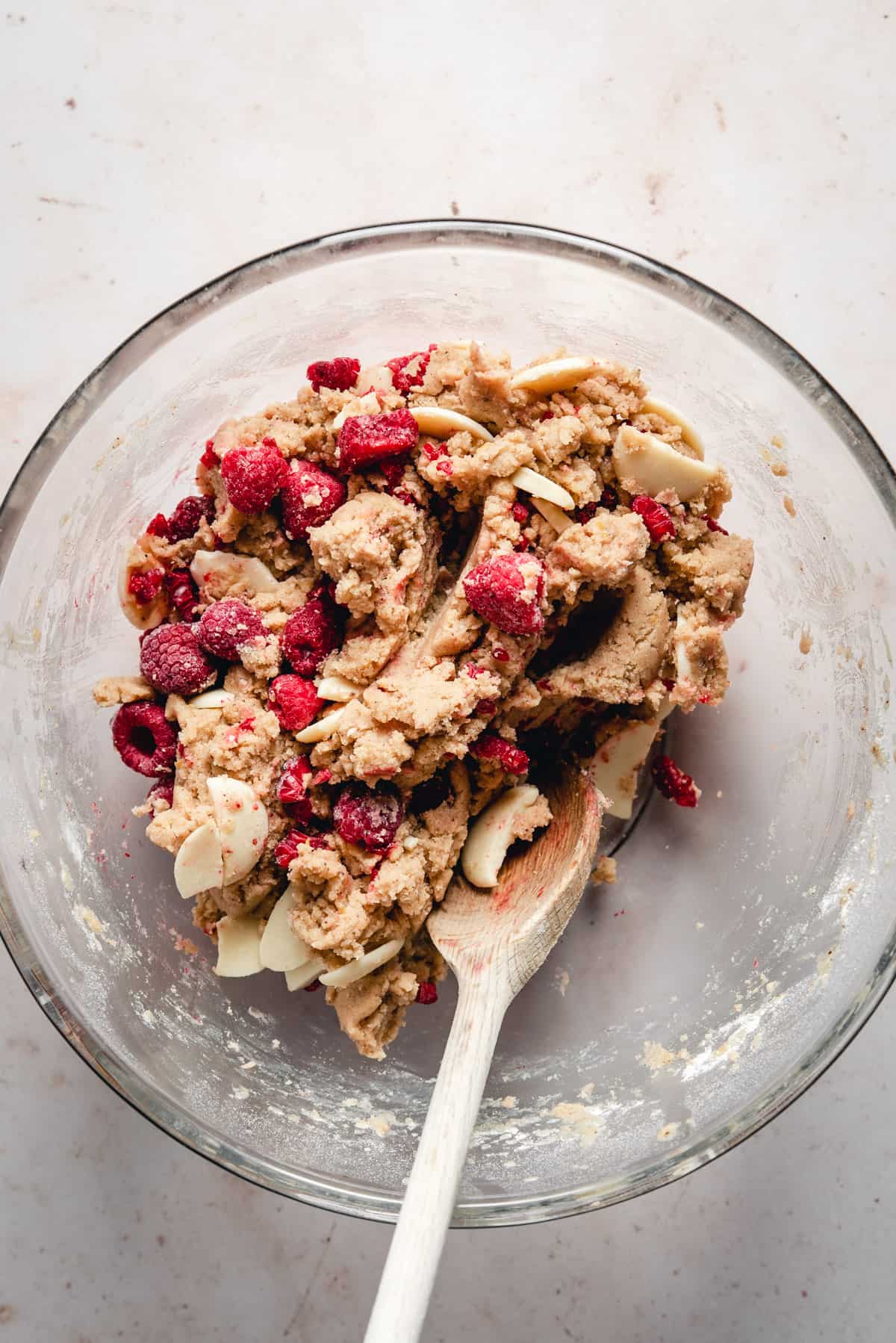 A glass bowl with raspberry white chocolate cookie dough