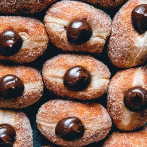 Brioche doughnuts filled with chocolate in a tray