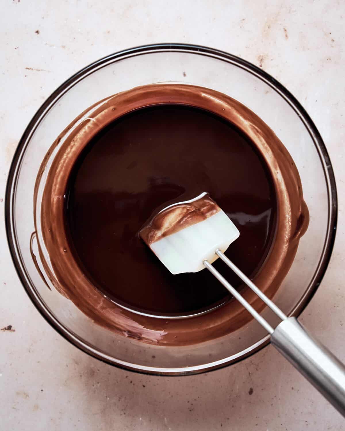 Melted chocolate and butter in a bowl.