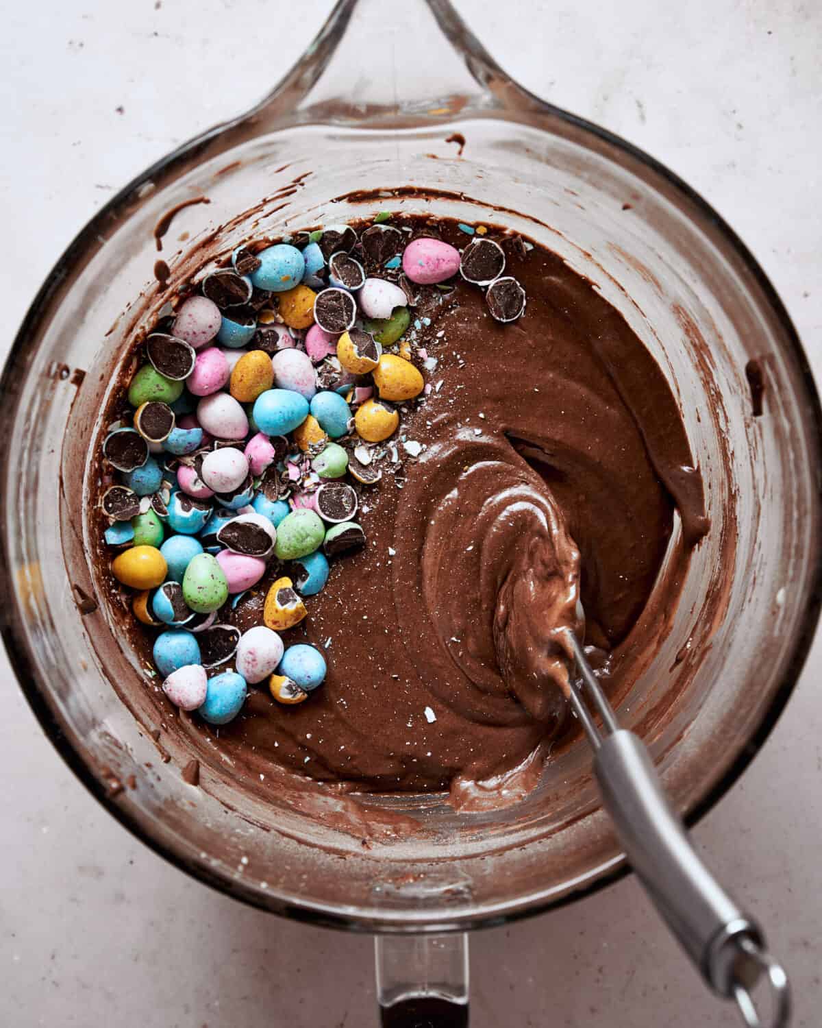 Roughly chopped mini eggs added to the bowl with the brownie batter.