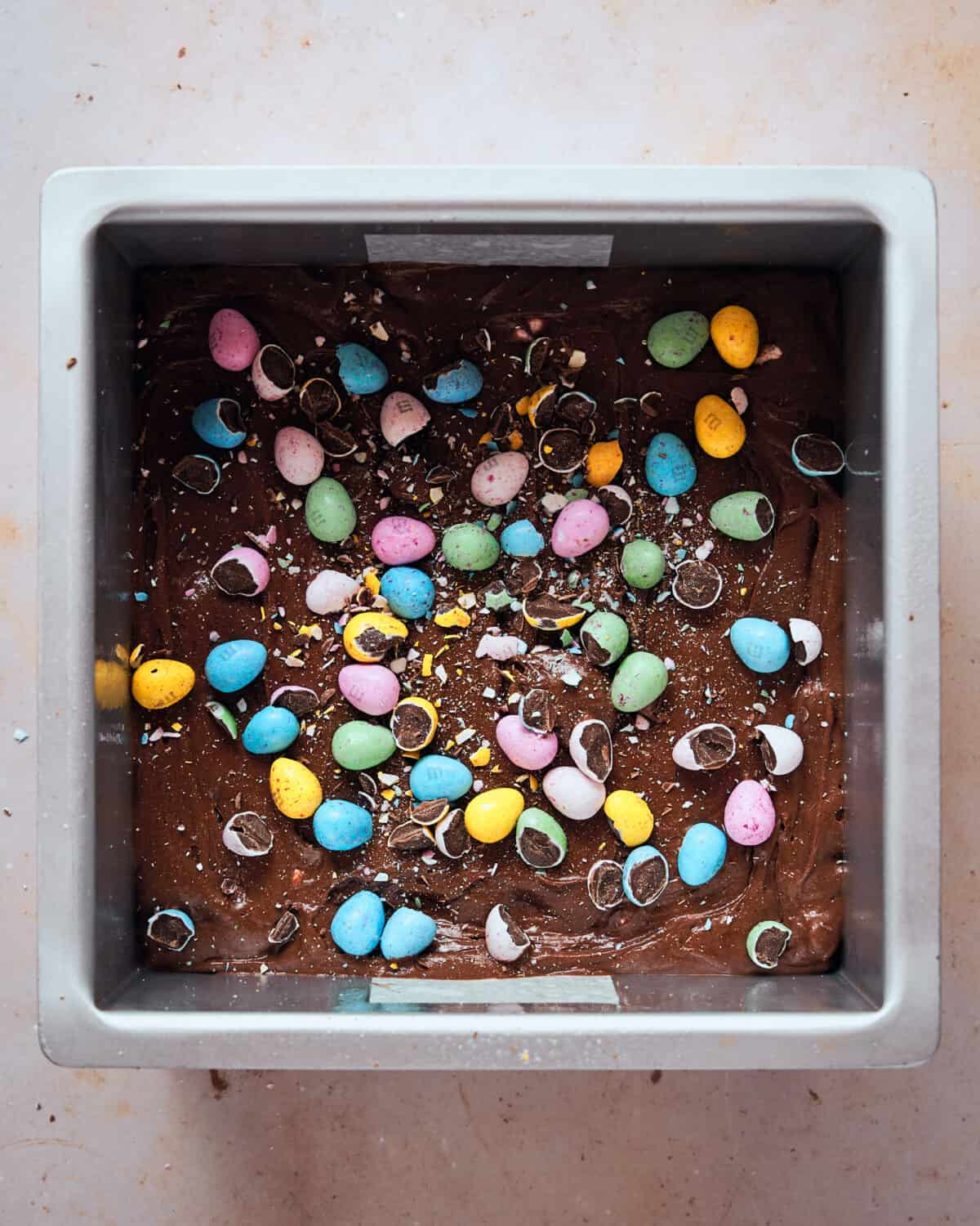 Mini Egg Brownies in a tin before baking.