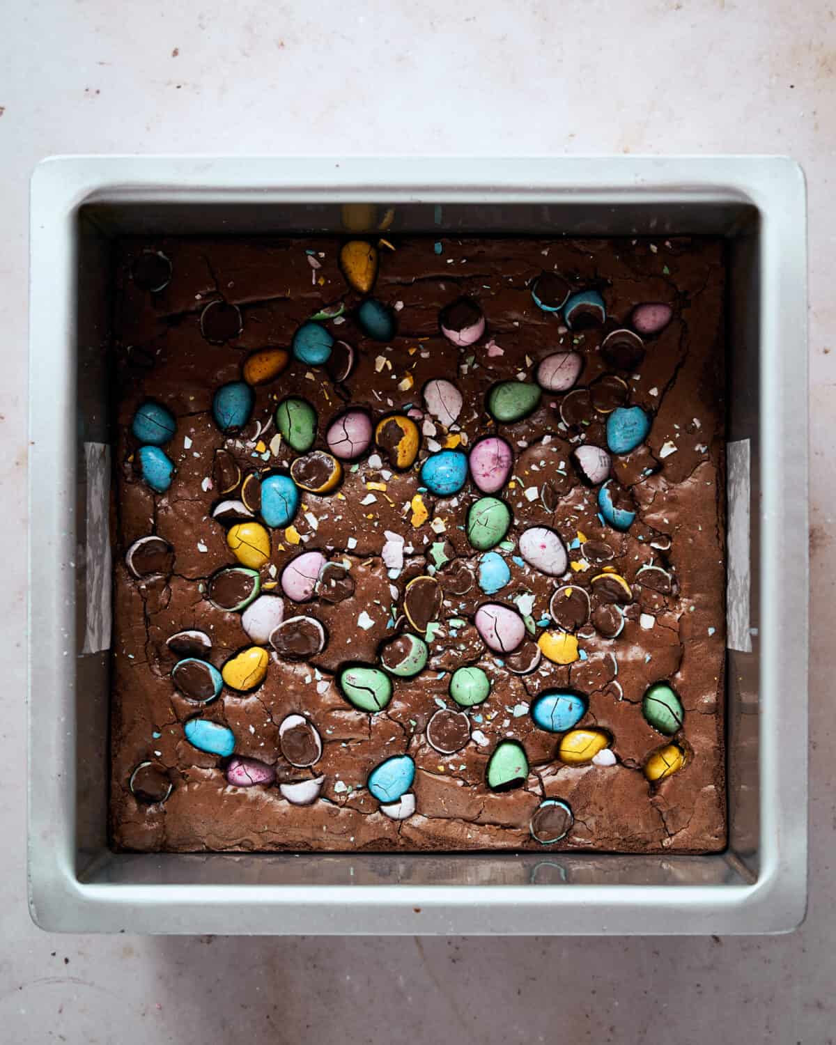 Mini Egg Brownies in a tin after baking.