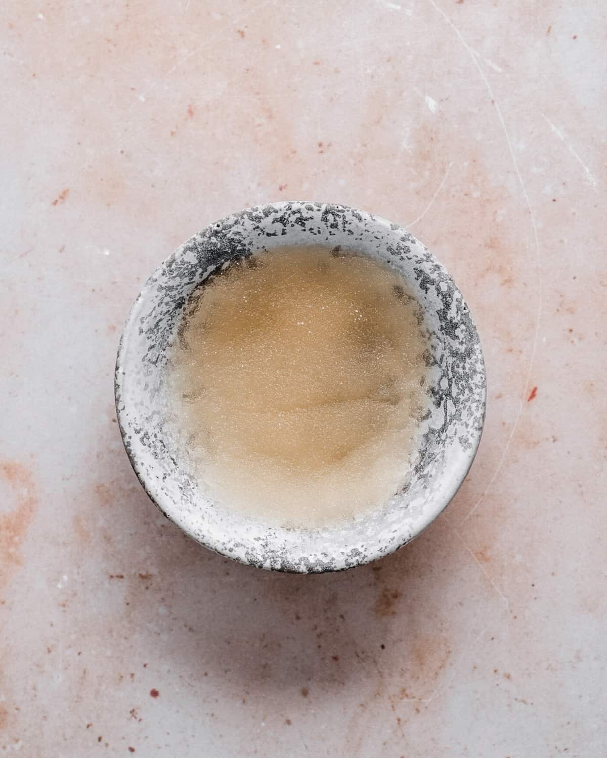 Gelatine powder and water in a small bowl.