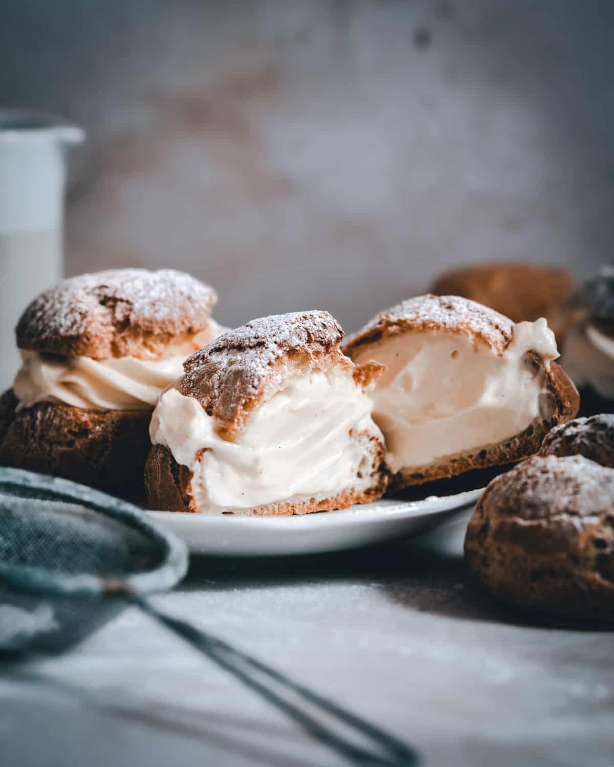 Choux a la creme cut in half to show the creme diplomate filling